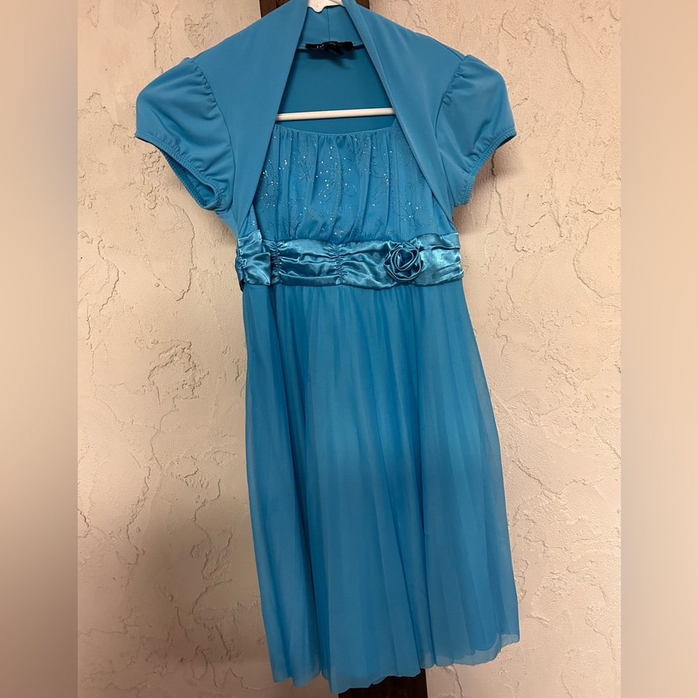 BCX girl size 14 blue dress with flower on front and tie back